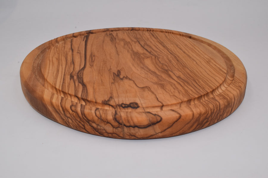 Small round cutting board with milled olive wood 