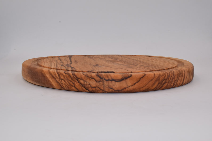 Small round cutting board with milled olive wood 