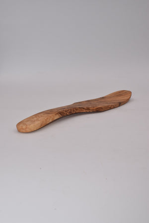 Curved tip headstock in olive wood