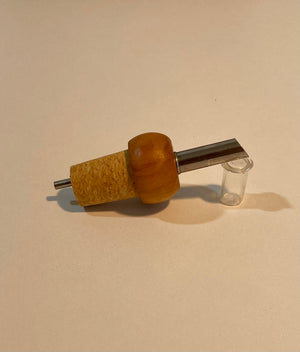 Cap with olive wood dispenser